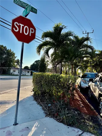 a view of a street with a sign board