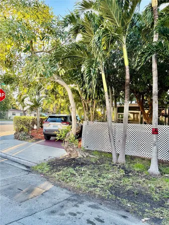 a view of a backyard with sitting area