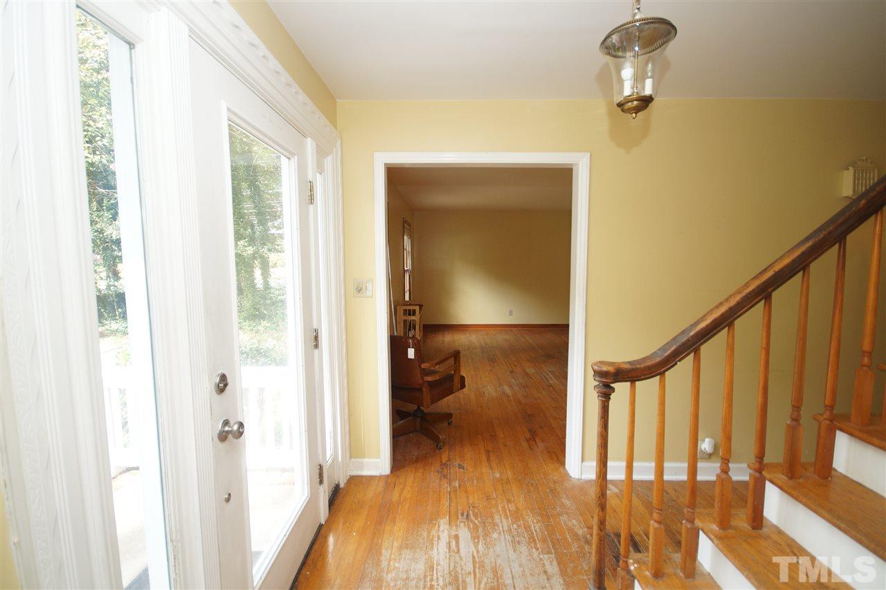 4520 Gates Street Raleigh, NC 27609 - Photo 2 of 11 a view of a hallway with wooden floor and staircase