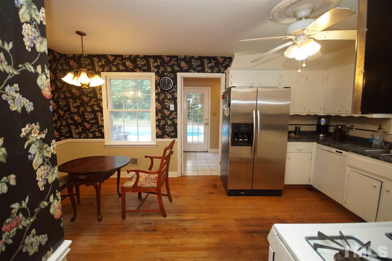 4520 Gates Street Raleigh, NC 27609 - Photo 5 of 11 a kitchen with a table chairs refrigerator and a table