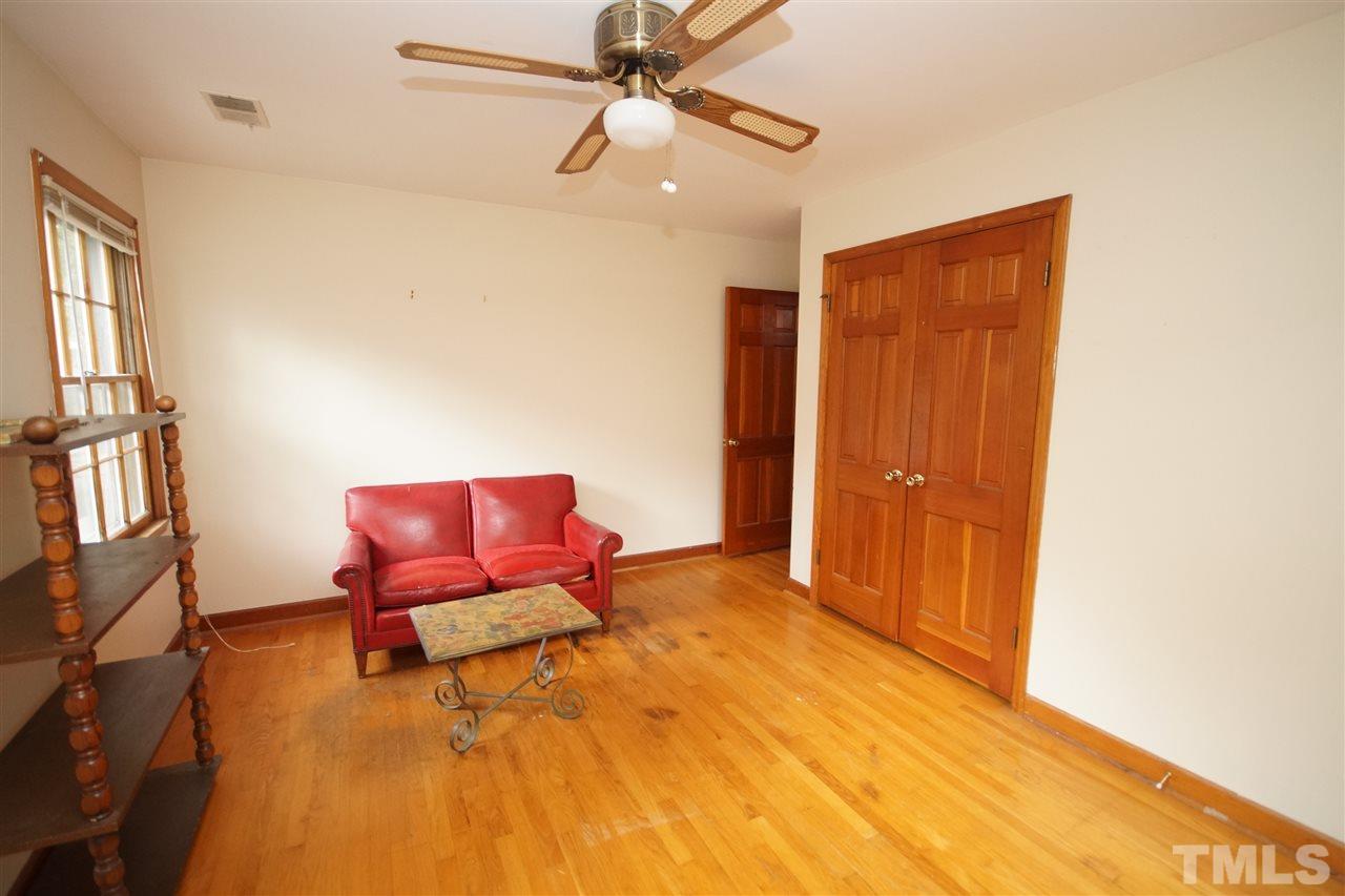 4520 Gates Street Raleigh, NC 27609 - Photo 8 of 11 a bedroom with a bed and furniture