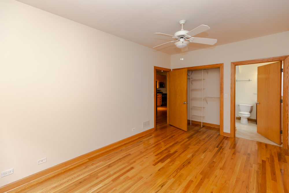 Undisclosed Address Chicago, IL 60657 - Photo 4 of 13 a view of an empty room with wooden floor