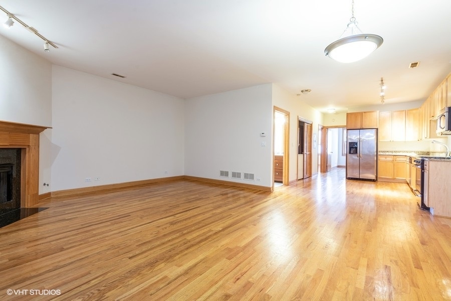 Undisclosed Address Chicago, IL 60657 - Photo 10 of 13 a view of empty room with wooden floor