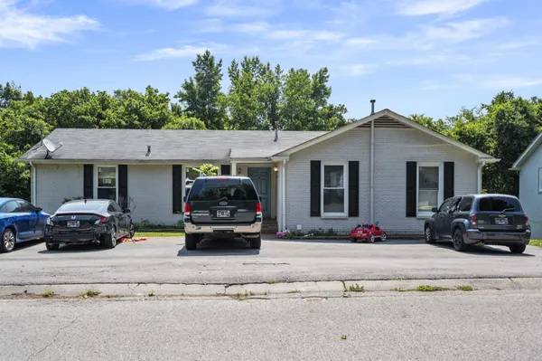 a car parked in front of a house