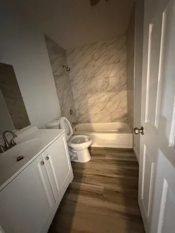 a bathroom with a sink and toilet