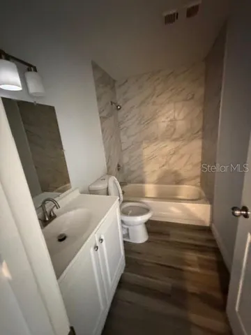 a bathroom with a sink and toilet