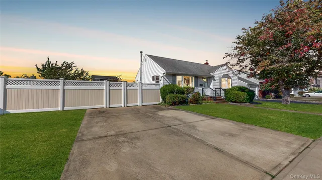 a view of a house with a yard and plants