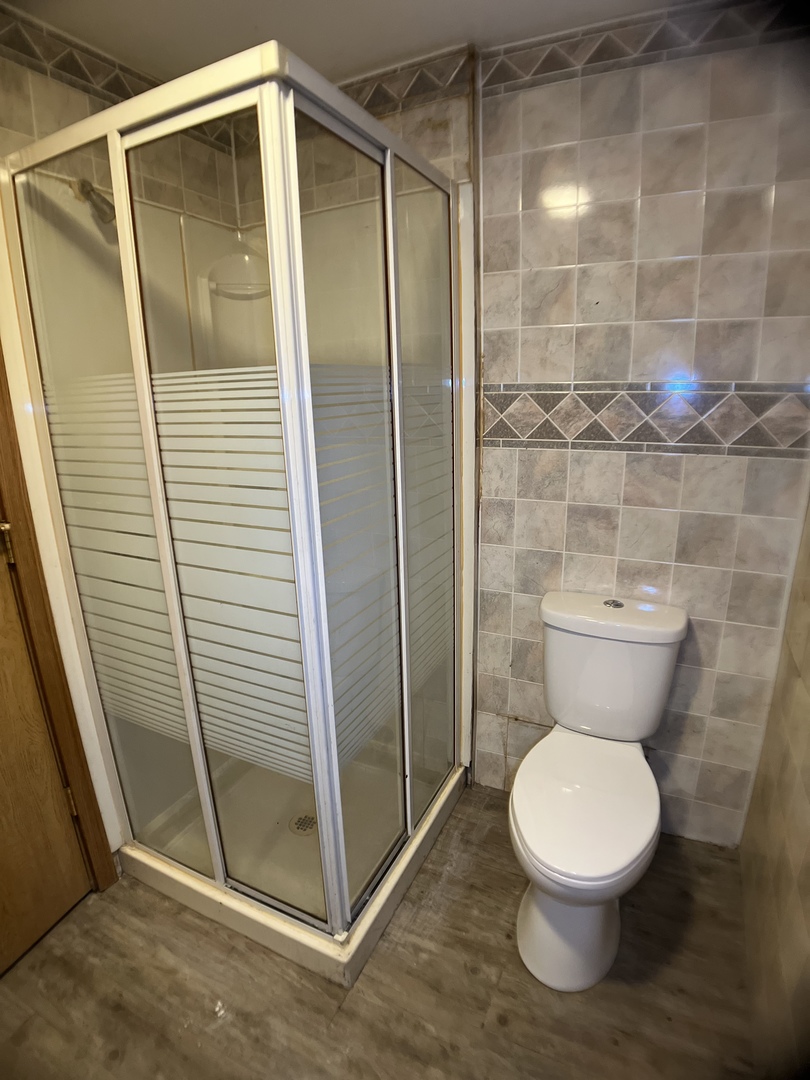 16237 Trumbull Avenue Markham, IL 60428 - Photo 12 of 18 a bathroom with a toilet and a shower