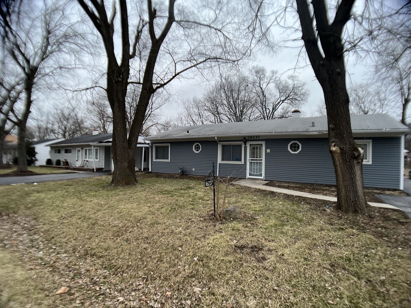 16237 Trumbull Avenue Markham, IL 60428 - Photo 2 of 18 a house with trees in front of it