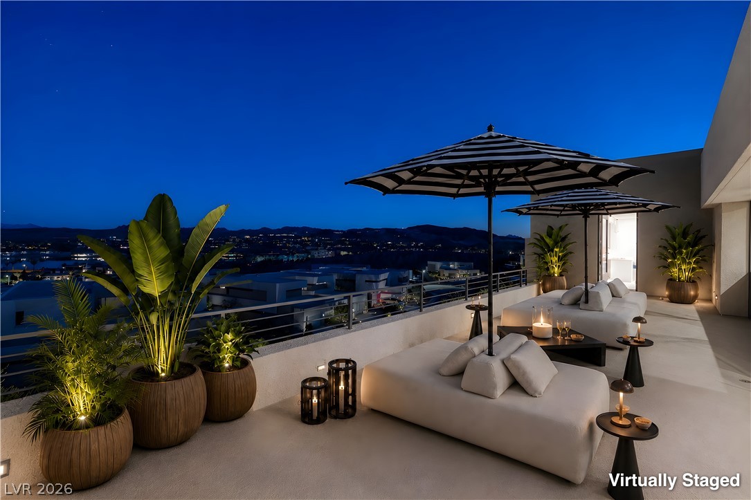 25 Falling Ridge Lane Henderson, NV 89011 - Photo 24 of 48 Unwind under the stars with city views from this generously sized private patio.