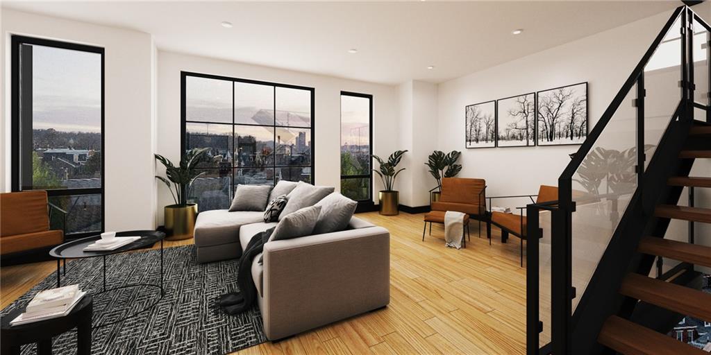 225 43rd Street Pittsburgh, PA 15201 - Photo 3 of 19 a living room with furniture and a floor to ceiling window