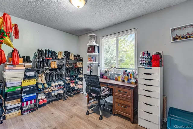 a view of a workspace with furniture and toys