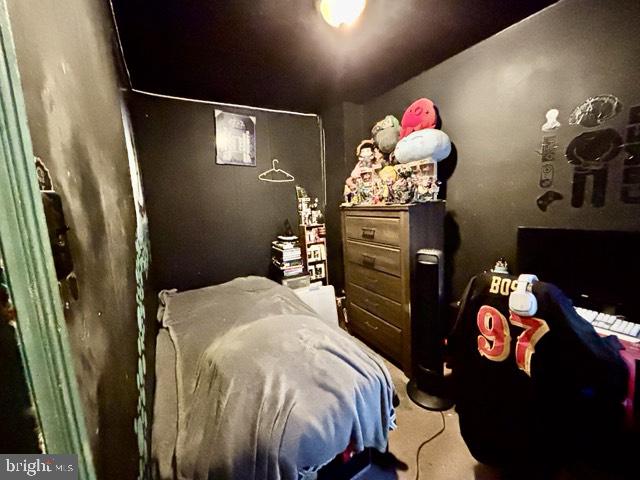 621 Lake Street Lancaster, PA 17603 - Photo 19 of 30 a bedroom with a bed and a chandelier