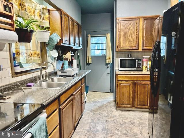 621 Lake Street Lancaster, PA 17603 - Photo 7 of 30 a kitchen with stainless steel appliances granite countertop a sink a stove and a refrigerator