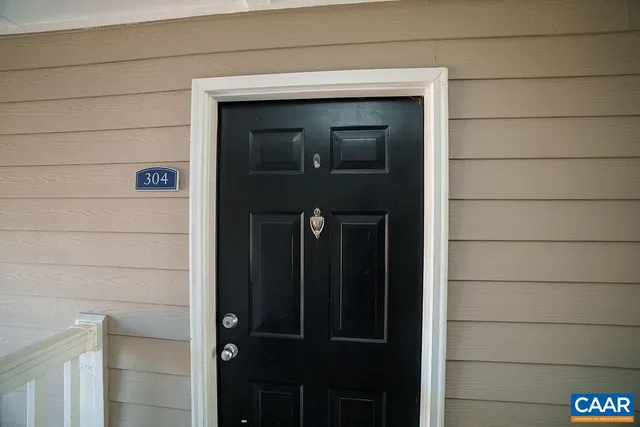 a front view of a house with parking space