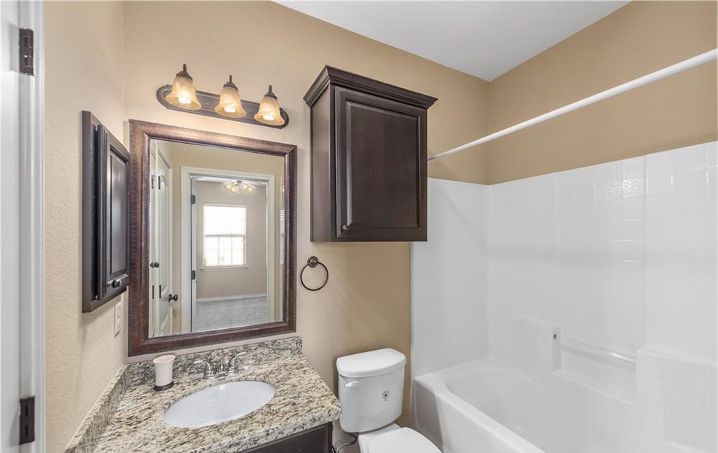 3201 Cain Road College Station, TX 77845 - Photo 6 of 8 Full bathroom with vanity and bathing tub / shower combination