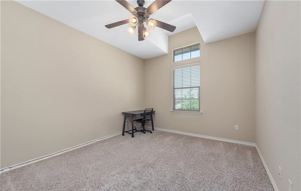 3201 Cain Road College Station, TX 77845 - Photo 7 of 8 Unfurnished room featuring carpet and ceiling fan