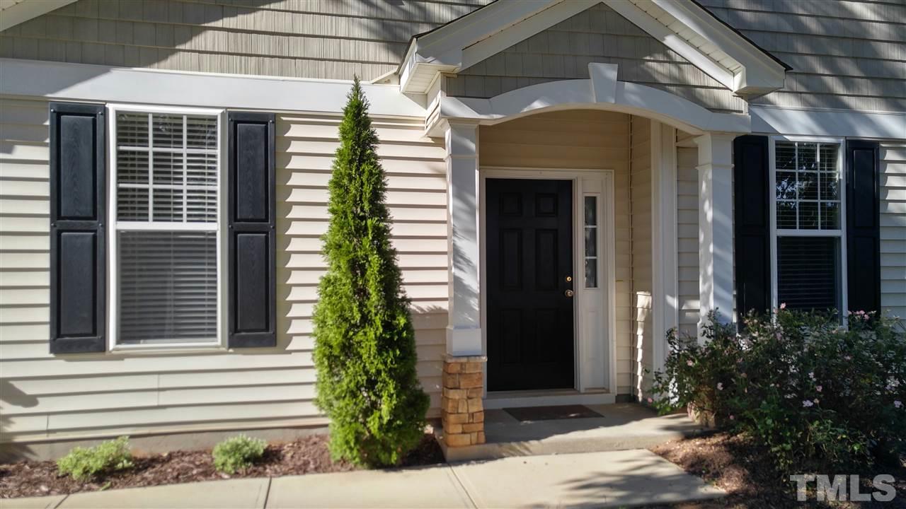 8300 Chimneycap Drive Raleigh, NC 27613 - Photo 2 of 3 a front view of a house with a yard