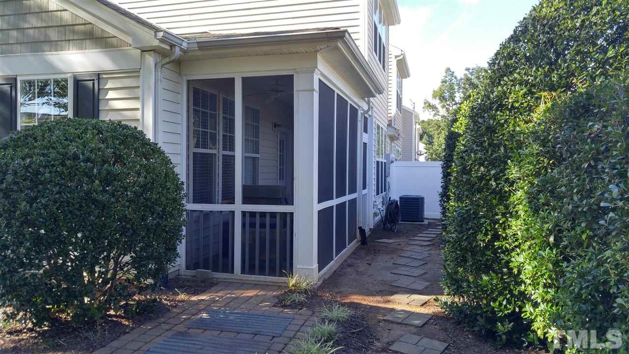 8300 Chimneycap Drive Raleigh, NC 27613 - Photo 3 of 3 a view of a pathway besides a house