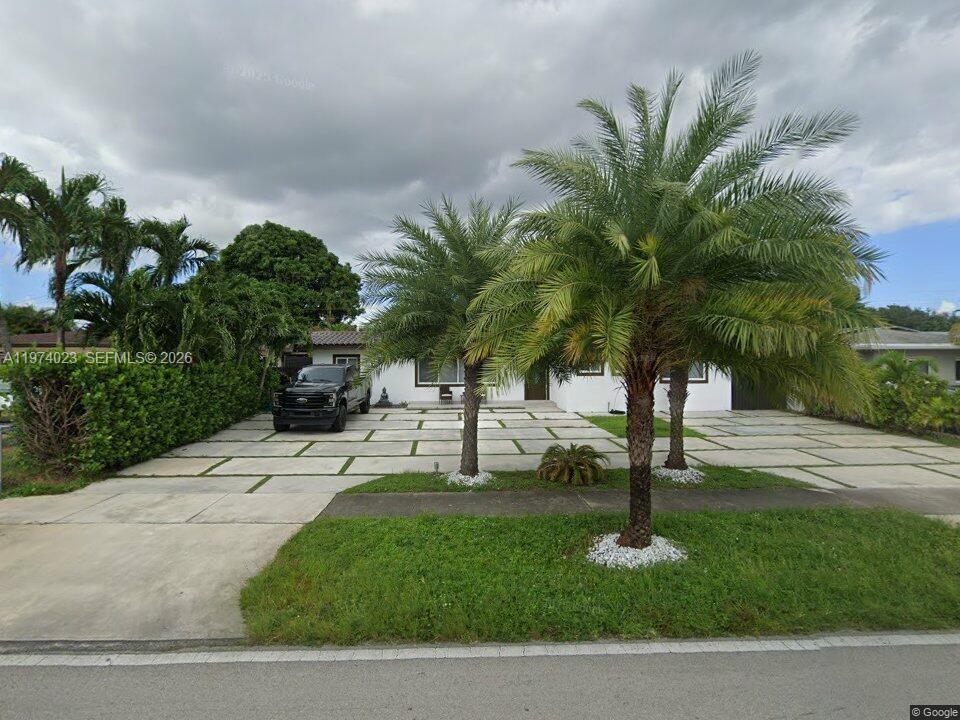 6271 Northwest 110th Street Hialeah, FL 33012 - Photo 19 of 53 a view of a yard with palm trees