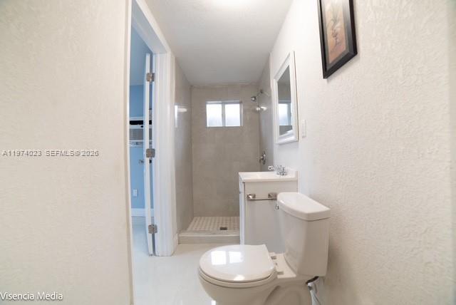 6271 Northwest 110th Street Hialeah, FL 33012 - Photo 23 of 53 a white toilet sitting next to a shower