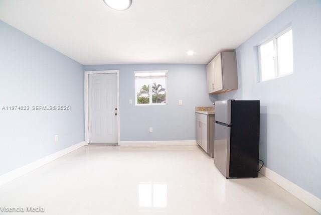 6271 Northwest 110th Street Hialeah, FL 33012 - Photo 26 of 53 a view of kitchen with refrigerator and window
