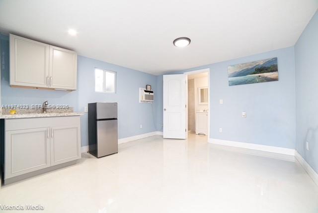 6271 Northwest 110th Street Hialeah, FL 33012 - Photo 27 of 53 a view of an empty room with window and cabinet