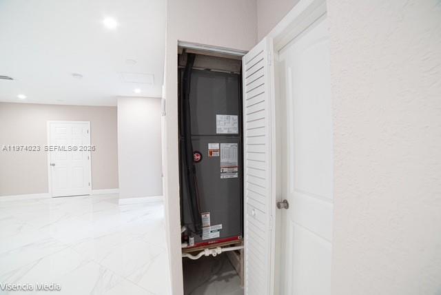 6271 Northwest 110th Street Hialeah, FL 33012 - Photo 28 of 53 a view of a hallway with wooden floor and a bathroom