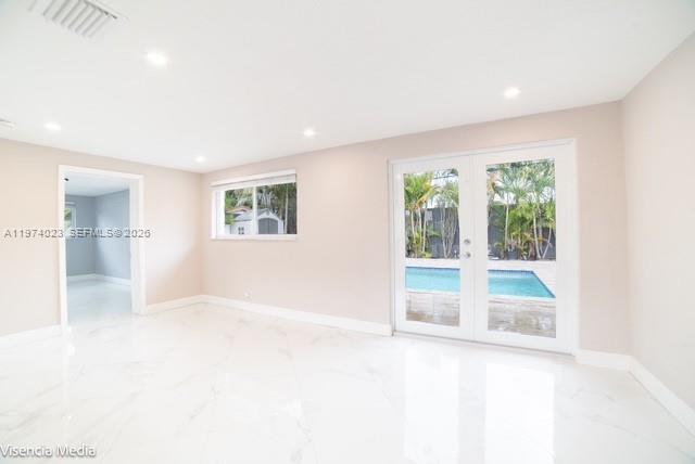 6271 Northwest 110th Street Hialeah, FL 33012 - Photo 33 of 53 a view of empty room with wooden floor and fan