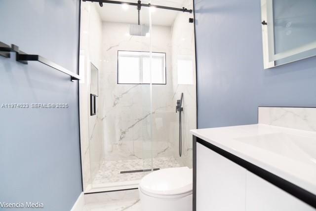 6271 Northwest 110th Street Hialeah, FL 33012 - Photo 35 of 53 a bathroom with a shower a toilet and a sink