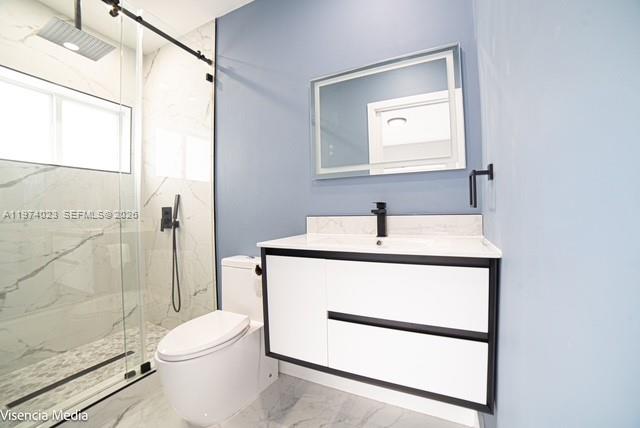 6271 Northwest 110th Street Hialeah, FL 33012 - Photo 36 of 53 a bathroom with a toilet sink and shower