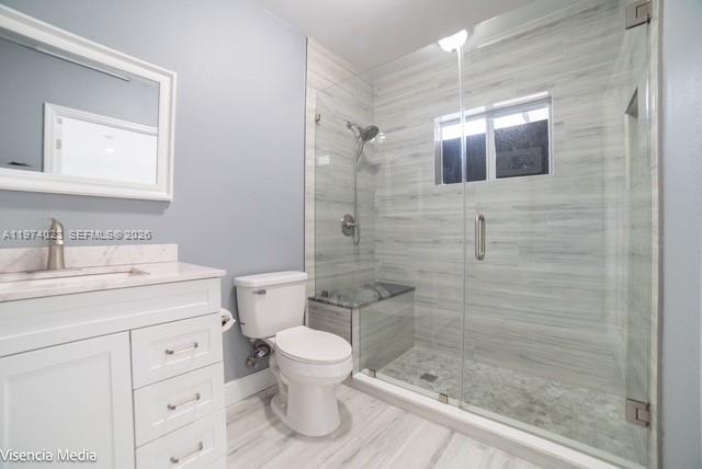 6271 Northwest 110th Street Hialeah, FL 33012 - Photo 39 of 53 a bathroom with a granite countertop sink toilet and shower