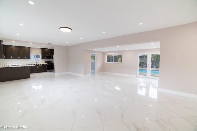 6271 Northwest 110th Street Hialeah, FL 33012 - Photo 4 of 53 a view of a kitchen with a sink and a microwave
