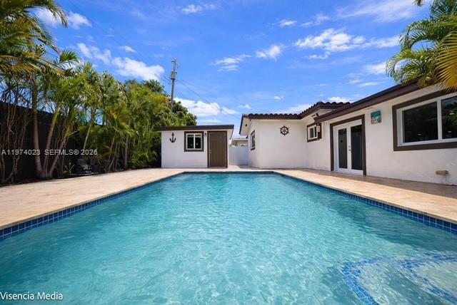 6271 Northwest 110th Street Hialeah, FL 33012 - Photo 7 of 53 a view of a house with backyard and a tree