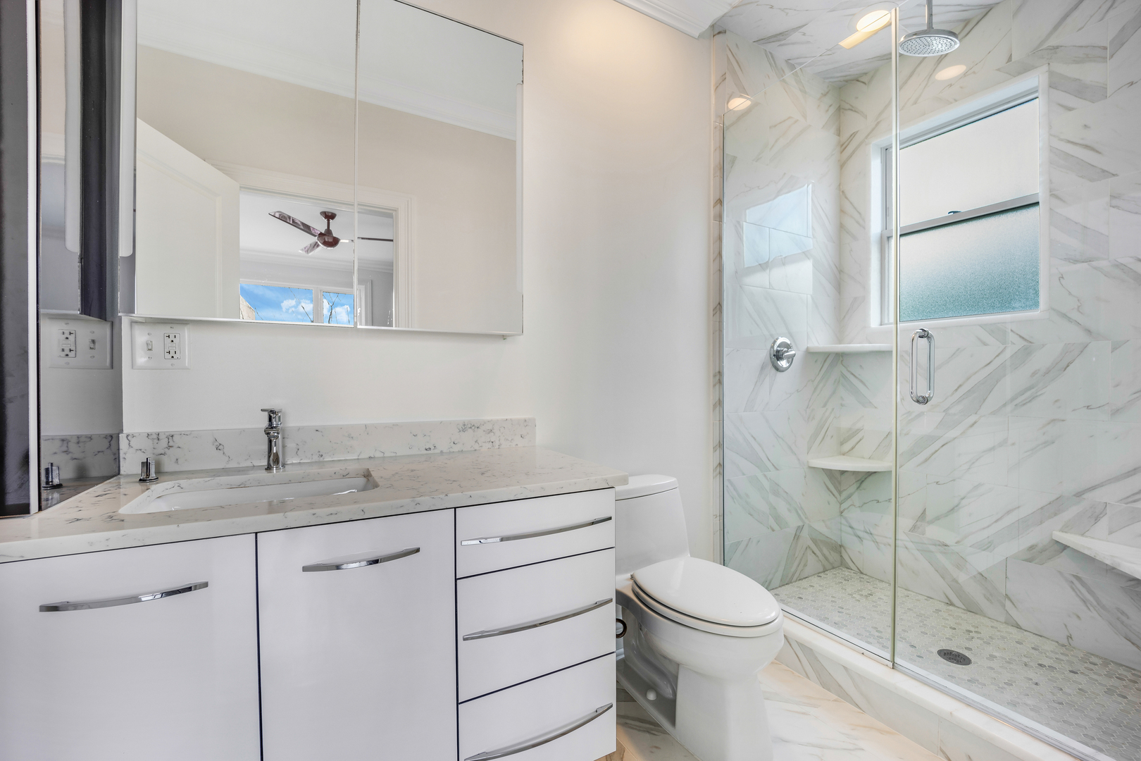 1317 West 18th Place, Unit 1F Chicago, IL 60608 - Photo 16 of 26 a bathroom with a sink toilet and shower