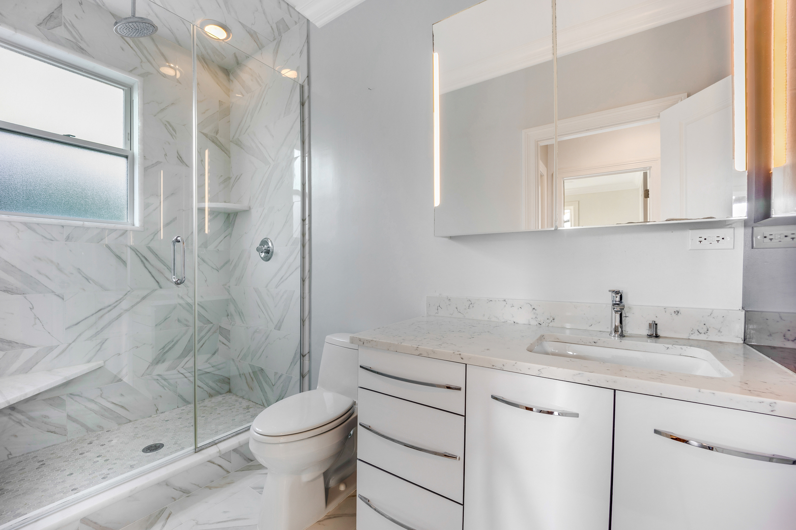 1317 West 18th Place, Unit 1F Chicago, IL 60608 - Photo 17 of 26 a bathroom with a sink a toilet and shower