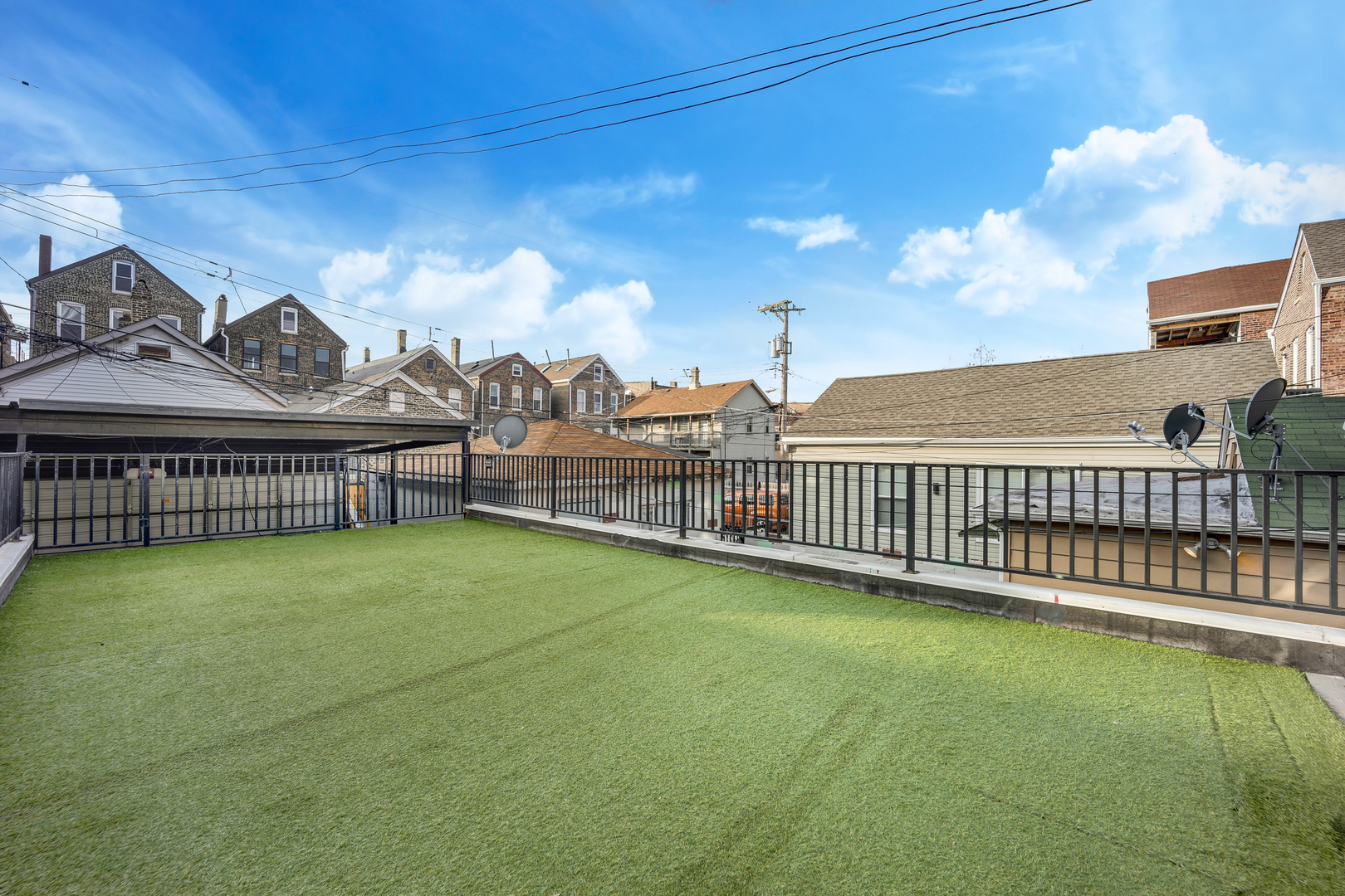 1317 West 18th Place, Unit 1F Chicago, IL 60608 - Photo 21 of 26 a view of a terrace with a bench