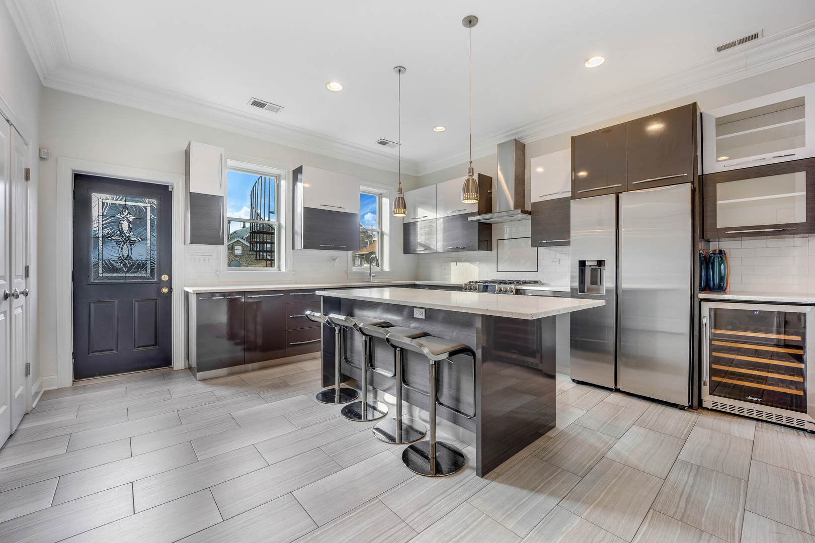 1317 West 18th Place, Unit 1F Chicago, IL 60608 - Photo 5 of 26 a kitchen with kitchen island a counter top space appliances and a cabinets