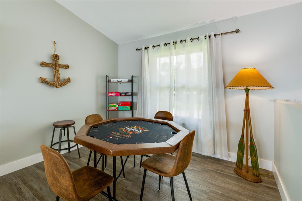 1633 Riverside Drive Daytona Beach, FL 32117 - Photo 15 of 26 a table and chairs in a small room