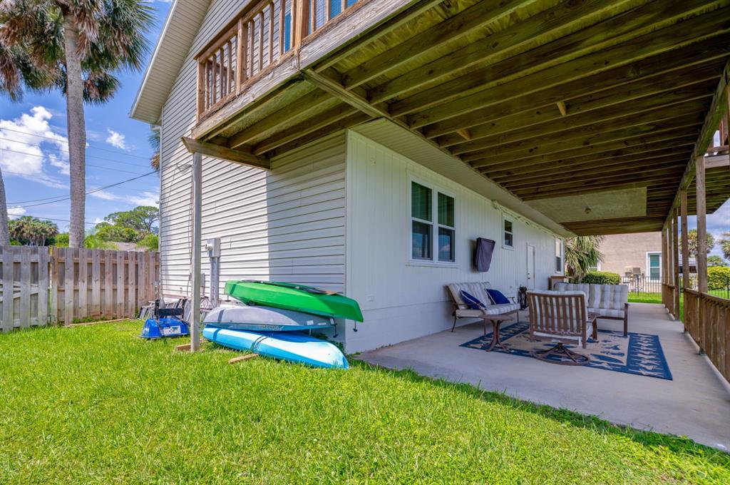 1633 Riverside Drive Daytona Beach, FL 32117 - Photo 25 of 26 a backyard of a house with table and chairs
