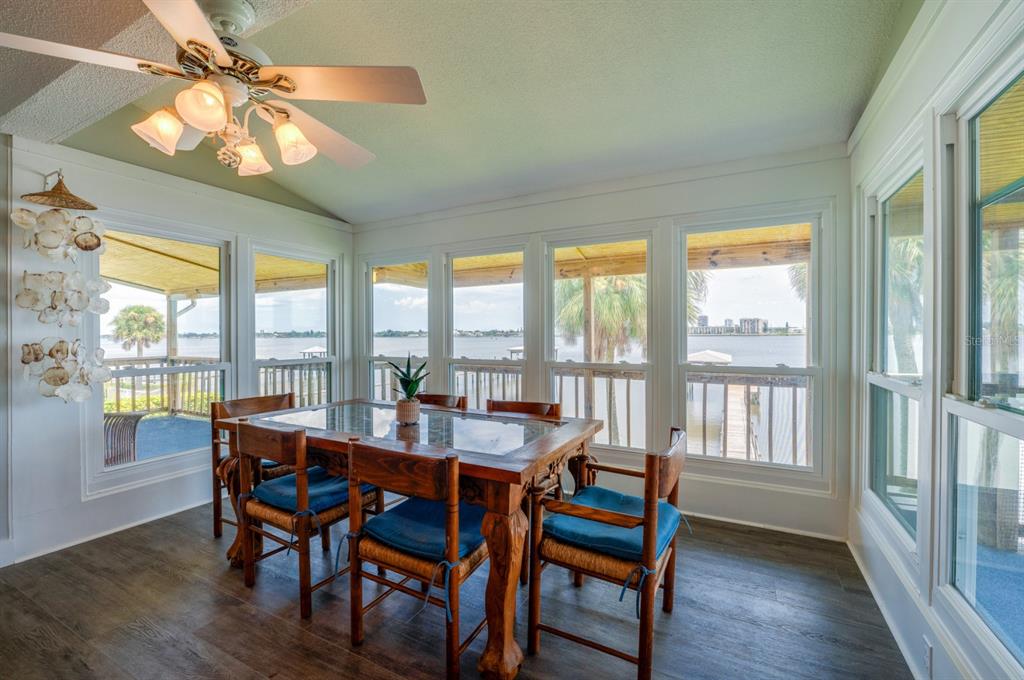 1633 Riverside Drive Daytona Beach, FL 32117 - Photo 8 of 26 a dining room with furniture a chandelier and wooden floor