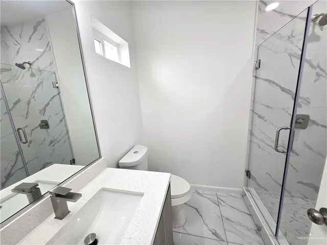 a bathroom with a sink and toilet