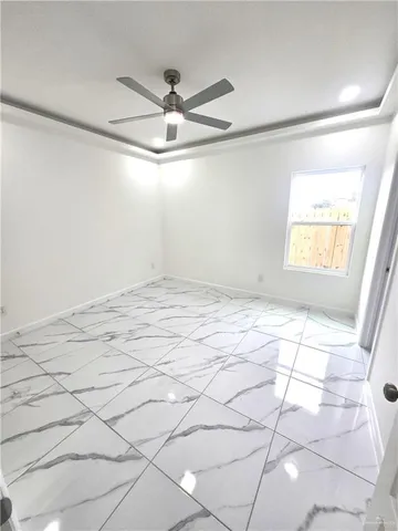 a view of an empty room and window