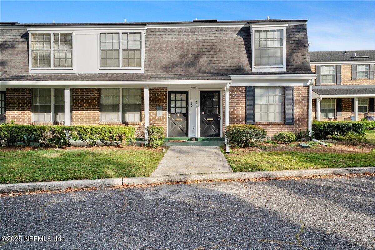 4358 Timuquana Road, Unit 208 Jacksonville, FL 32210 - Photo 1 of 28 a front view of house with yard and green space