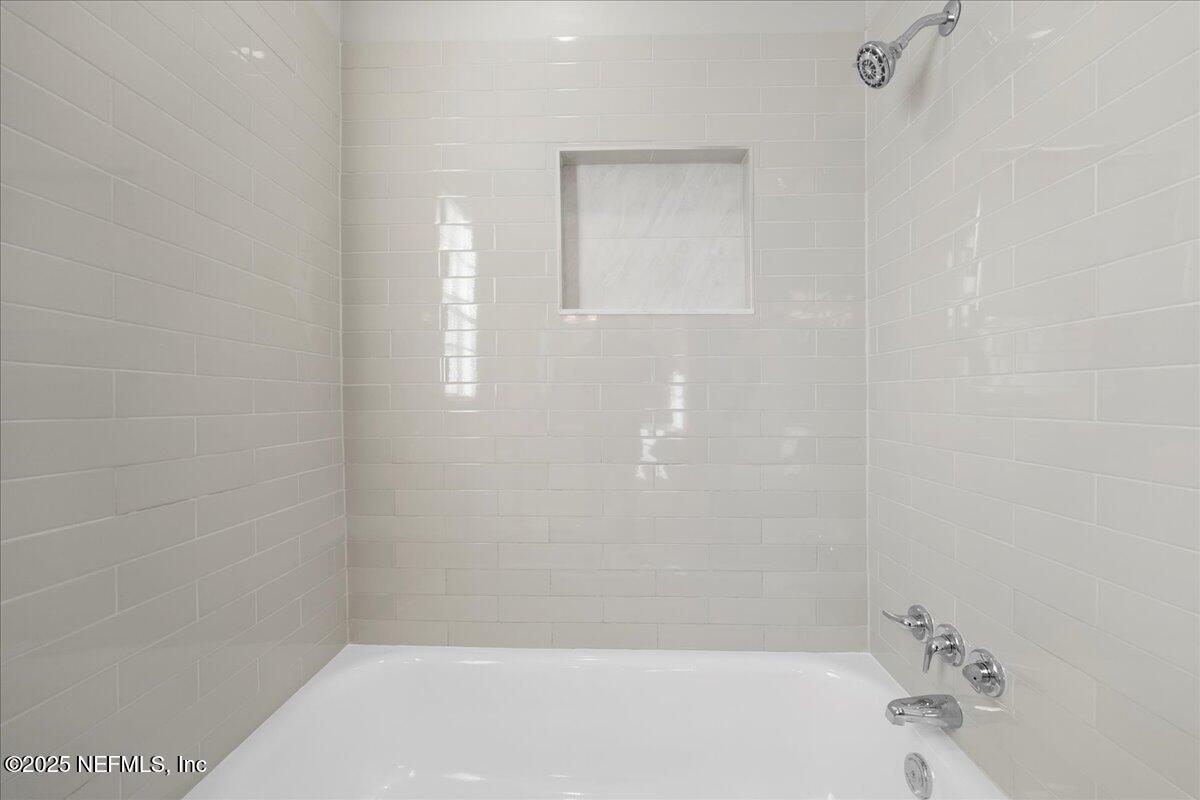 4358 Timuquana Road, Unit 208 Jacksonville, FL 32210 - Photo 19 of 28 a bathroom with a bathtub