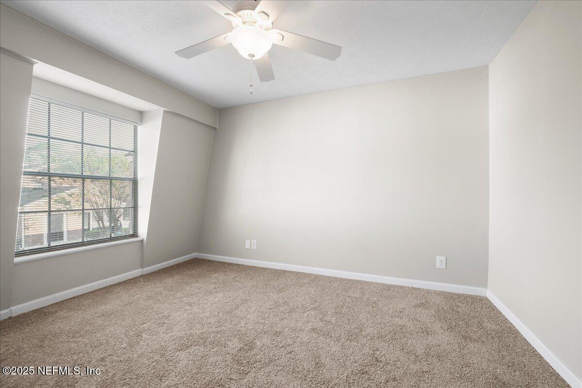 4358 Timuquana Road, Unit 208 Jacksonville, FL 32210 - Photo 22 of 28 an empty room with a window