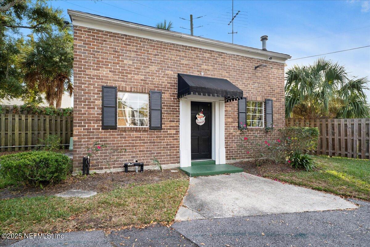 4358 Timuquana Road, Unit 208 Jacksonville, FL 32210 - Photo 26 of 28 a front view of a house with garden