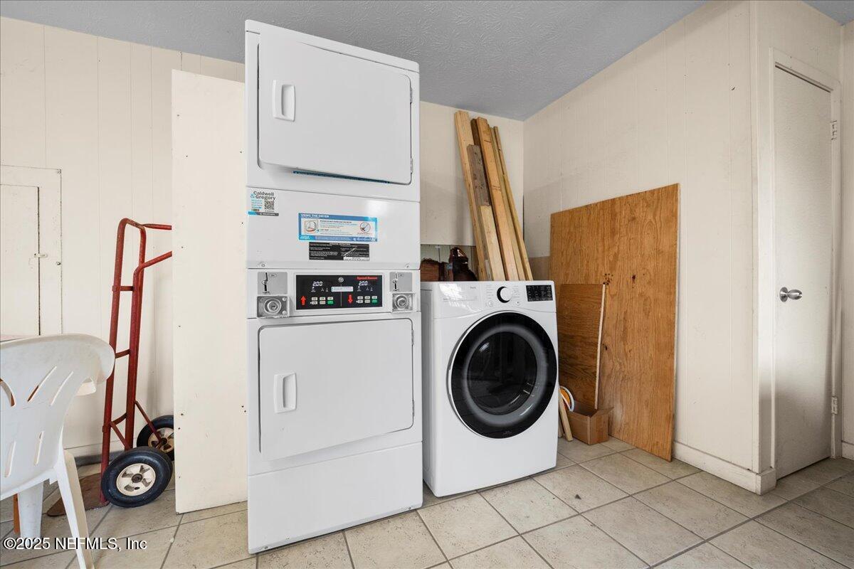 4358 Timuquana Road, Unit 208 Jacksonville, FL 32210 - Photo 27 of 28 a utility room with dryer and washer