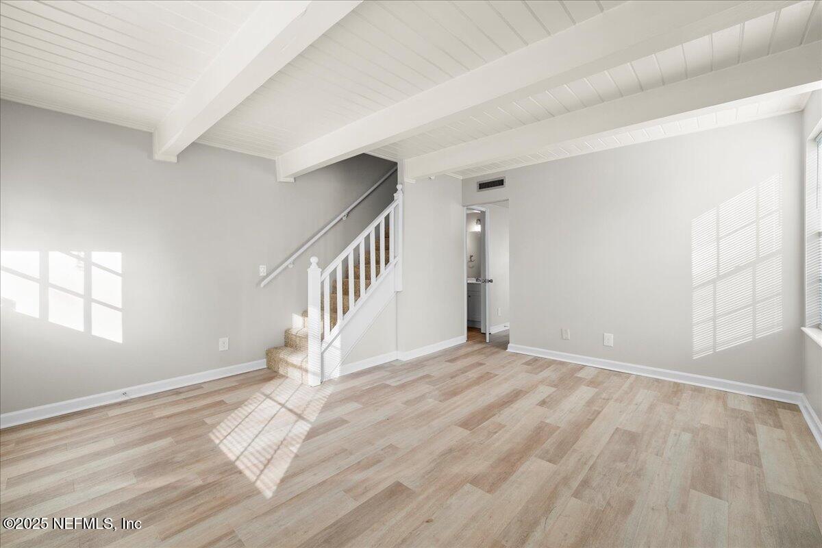4358 Timuquana Road, Unit 208 Jacksonville, FL 32210 - Photo 9 of 28 a view of empty room with wooden floor and fan