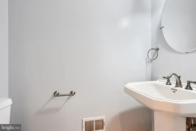 a bathroom with a sink and mirror